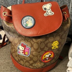 Signature coated canvas and refined calf leather